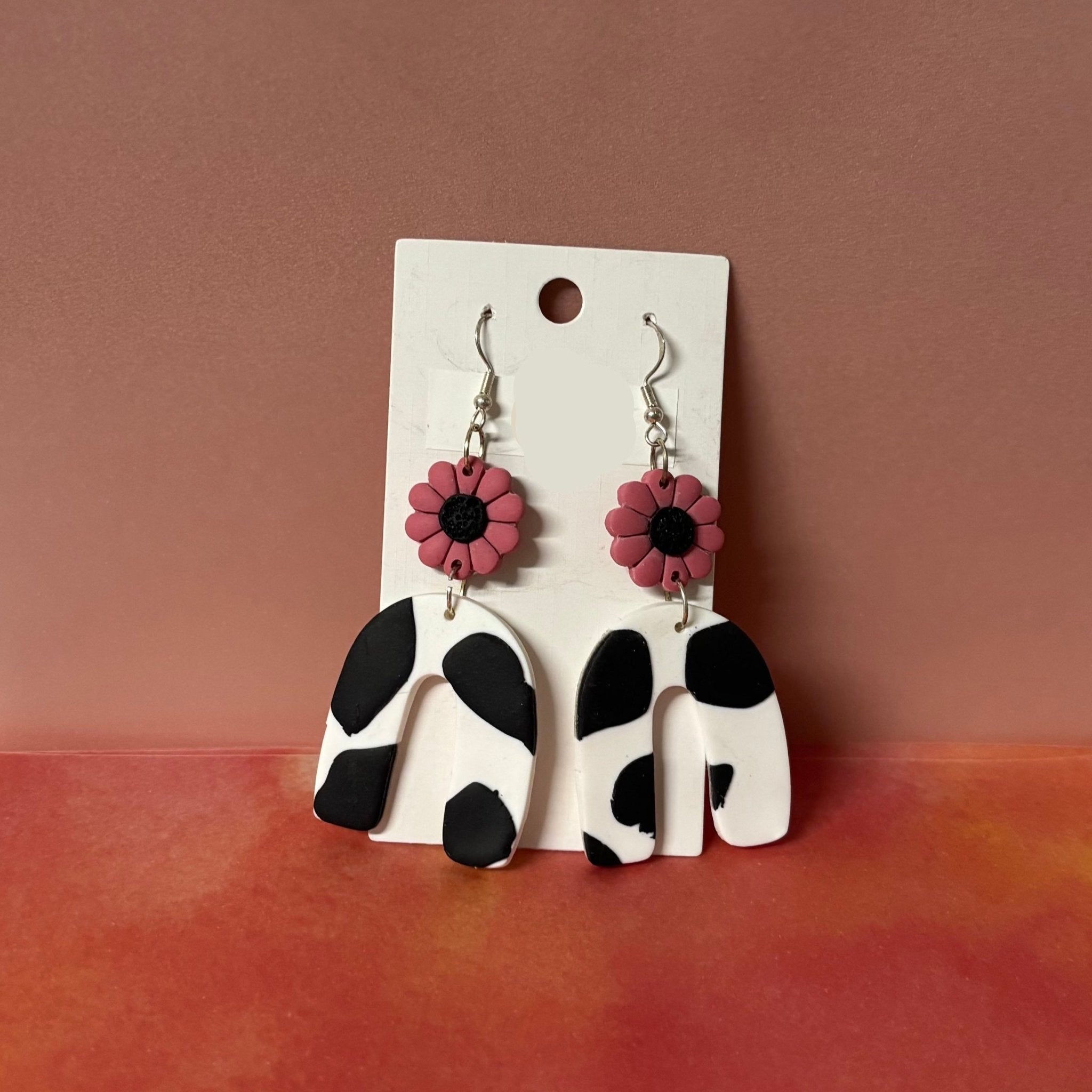 Handmade Polymer Clay Earrings: Cow print and pink flower dangles - Teagan's Jewellery | Buy Online from The Home Crafters